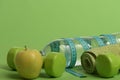 Dumbbells in green color, water bottle, measure tape, towel, fruit Royalty Free Stock Photo