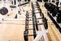 Dumbbells in modern sports club, gym or fitness center