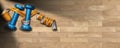 Dumbbells and tape measure on wooden gym floor Royalty Free Stock Photo