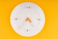 A dummy clock in which a plate instead of a dial and the hands are cigarettes Royalty Free Stock Photo