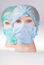 Dummy doctor heads wearing textile surgical cap and mask