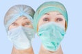 Dummy doctor heads wearing textile surgical cap and mask