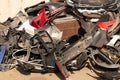 Dump of broken bumpers and parts of cars on the street like garbage