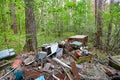 Dump old metal objects in the woods, rusty scrap metal. Environ Royalty Free Stock Photo