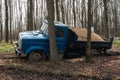 Dump truck car stuck in mud on road. Blurry mud bad road in the park. ÃÂ¢ruck dump car with sand stopped due to wet dirty on Royalty Free Stock Photo