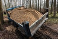 Dump truck car stuck in mud on road. Blurry mud bad road in the park. ÃÂ¢ruck dump car with sand stopped due to wet dirty on Royalty Free Stock Photo