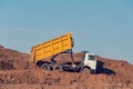 Dump truck is dumping gravel on an excavation site Royalty Free Stock Photo