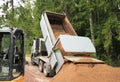 Building Site - Dump Truck Emptying Load