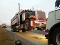 Dump truck getting towed