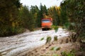 The dump truck moves on a muddy road Royalty Free Stock Photo