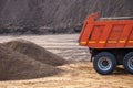 Dump truck and a pile of sand at a construction site close up Royalty Free Stock Photo