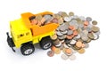 Dump truck toy loading coins isolated on white background. Truck toy load coins moneys