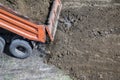 Dump truck unloading soil at construction site Royalty Free Stock Photo