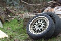 Dumped car tyres. Fly-tipping old tyre waste and rubber recycling Royalty Free Stock Photo