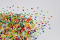 dumped multicolord plastic resin granulate on white background Royalty Free Stock Photo