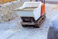 Dumper tracked wheelbarrow is used by construction workers during pouring of a concrete cement Royalty Free Stock Photo