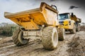 Dumper Truck and Lorry in Mud on Construction Site Royalty Free Stock Photo