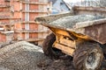 Dumper truck unloading construction gravel, sand and curshed stones