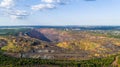 Dumpers and Machines are Working in the Quarry Mine Aerial View Royalty Free Stock Photo