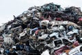 Dumping ground. Scrap metal heap. Compressed crushed cars is returned for recycling. Iron waste ground in the industrial area. Royalty Free Stock Photo