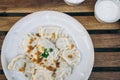 Dumplings with bacon and herbs on a plate