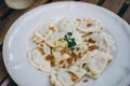 Dumplings with bacon and herbs on a plate