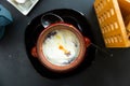 Dumplings baked with cream in clay pot. Russian cuisine