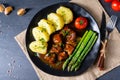 Dumplings with beef goulash and green asparagus Royalty Free Stock Photo