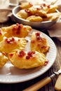 Dumplings with curd and potato stuffing sprinkled with pork greaves on a white plate, Royalty Free Stock Photo