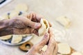 Dumplings. Dough with cabbage filling on the cook`s hands Royalty Free Stock Photo