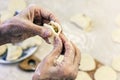 Dumplings. Dough with cabbage filling on the cook`s hands Royalty Free Stock Photo