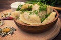 Dumplings with the liver. Wooden background. Top view