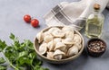 Dumplings with meat. The Russian traditional dish is Siberian pelmeni. Served with fresh herbs, butter and vegetables Royalty Free Stock Photo