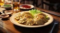 Dumplings with pork and potatoes, served with onion sauce