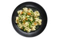 Dumplings Soup with Ravioli pasta in a bowl with greens. Isolated on white background.