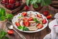 Dumplings with strawberry Vareniki, pierogi, rustic background