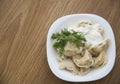 Dumplings stuffed with potatoes with sour cream