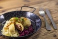 dumpllings filled with smoked meat served with red and white cabbage Royalty Free Stock Photo