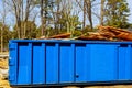 Dumpster, recycle waste and garbage bins near new construction site of appartment houses building