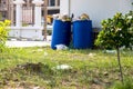 Dumpsters being full with garbage. Overflowing garbage bins with household waste. overflowing blue garbage bin.