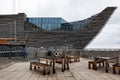 Bench with a table for relax in front of ship-shaped building of V and A Design Museum in Dundee, Scotland