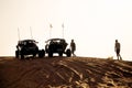 Dune Buggies being driven by tourists at aa Desert Safari park in the red sand dunes near Dubai