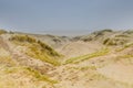 Dune landscape Dutch coast with sand drifts and wind eroded deep holes Royalty Free Stock Photo