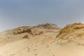 Dune landscape Dutch coast with sand drifts and wind eroded deep holes Royalty Free Stock Photo