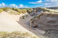 Dune landscape Dutch coast with sand drifts and wind eroded deep holes Royalty Free Stock Photo