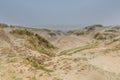 Dune landscape Dutch coast with sand drifts and wind eroded deep holes Royalty Free Stock Photo