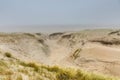 Dune landscape Dutch coast with sand drifts and wind eroded deep holes Royalty Free Stock Photo