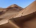 Dune walking in the Namib Desert -Sossusvlei - Namibia Royalty Free Stock Photo