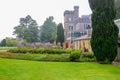 DUNEDIN, NEW ZEALAND - FEBR 10, 2015: foggy morning in the Garden of Larnach Castle Royalty Free Stock Photo