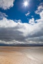 Dunes beach white clouds blue sky background Royalty Free Stock Photo